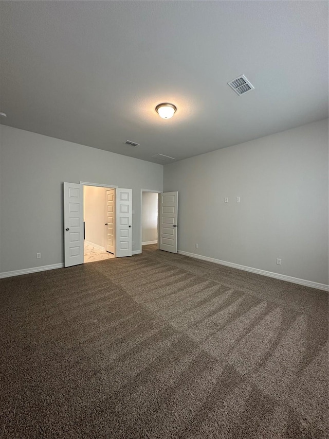 unfurnished bedroom with carpet floors