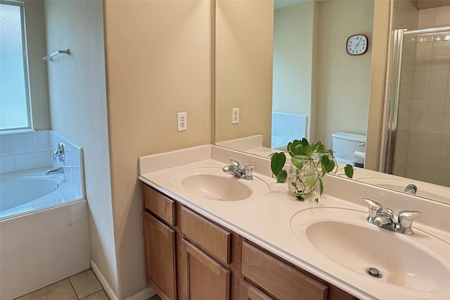 full bathroom featuring tile patterned flooring, vanity, independent shower and bath, and toilet