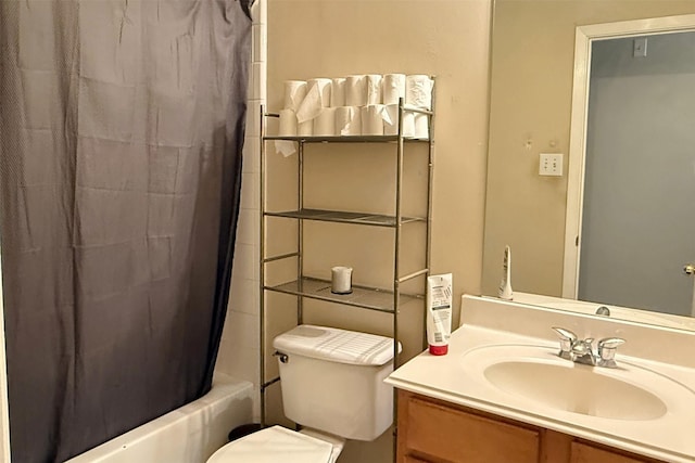 full bathroom with vanity, shower / bath combo, and toilet