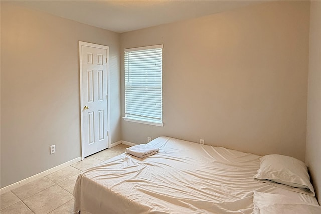 bedroom with light tile patterned flooring