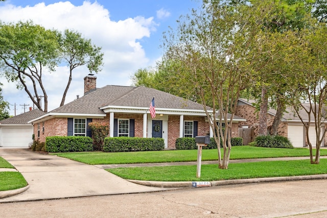 ranch-style home featuring a garage and a front lawn