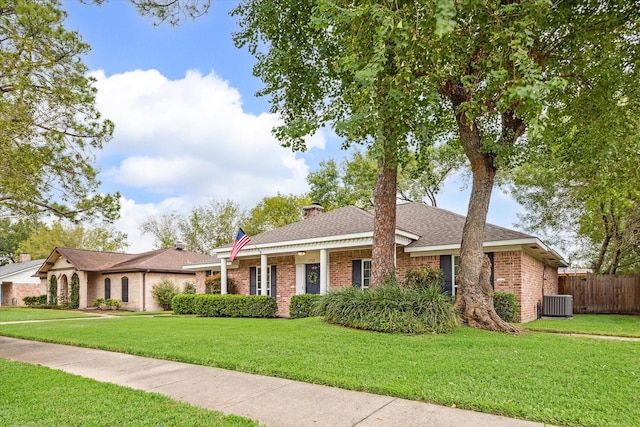 single story home with a front yard