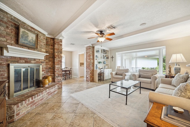 living room with ornamental molding, a brick fireplace, ceiling fan, and a textured ceiling