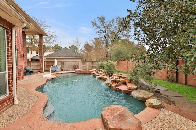 view of pool featuring an in ground hot tub, pool water feature, and a patio