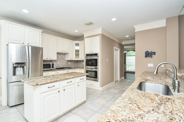 kitchen with white cabinetry, sink, and appliances with stainless steel finishes