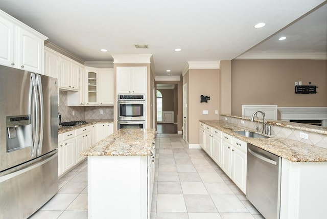 kitchen featuring white cabinetry, appliances with stainless steel finishes, and sink