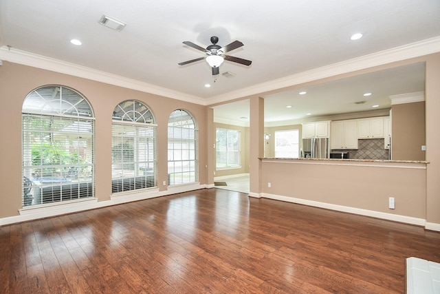 unfurnished living room with dark hardwood / wood-style flooring, ornamental molding, and ceiling fan