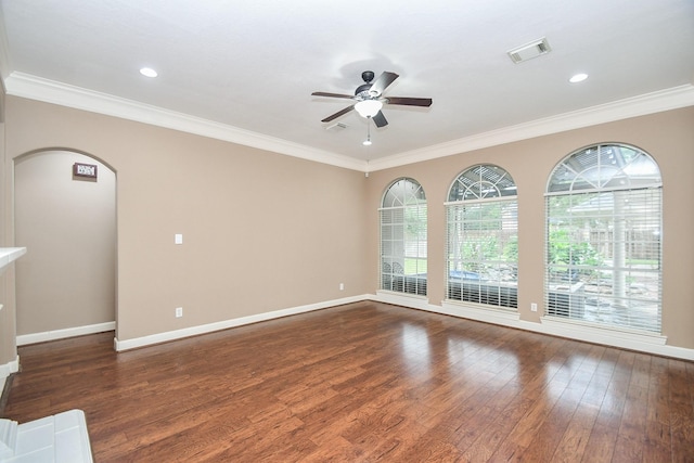 spare room featuring crown molding, ceiling fan, and dark hardwood / wood-style floors