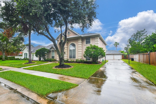 view of front of home with a garage and a front yard