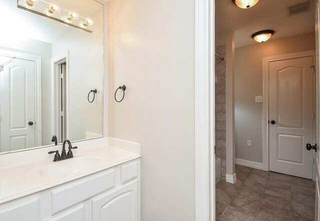 bathroom with vanity and tile patterned floors