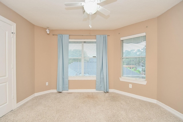 carpeted empty room with ceiling fan