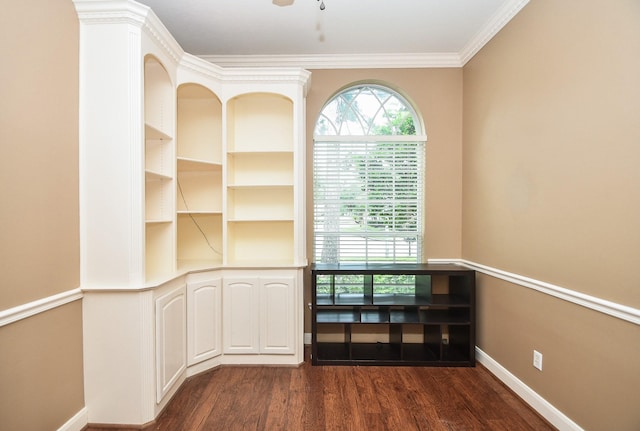 empty room featuring ornamental molding and dark hardwood / wood-style floors