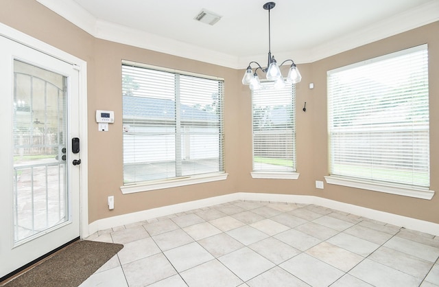 unfurnished dining area featuring crown molding, a chandelier, and light tile patterned flooring