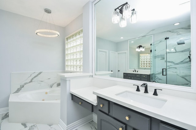 bathroom featuring vanity and separate shower and tub