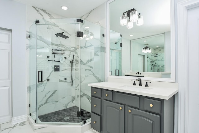 bathroom with vanity and a shower with shower door