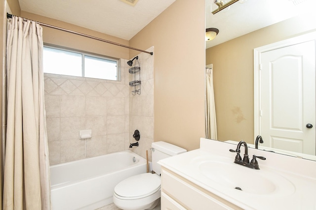 full bathroom with vanity, shower / tub combo with curtain, and toilet