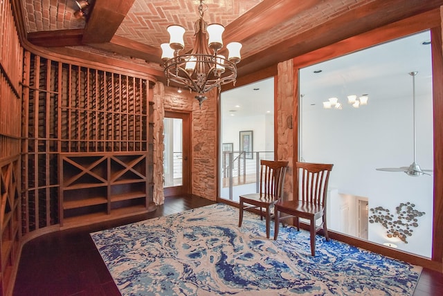 wine cellar featuring brick ceiling, dark hardwood / wood-style flooring, and a notable chandelier