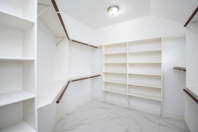 spacious closet featuring lofted ceiling