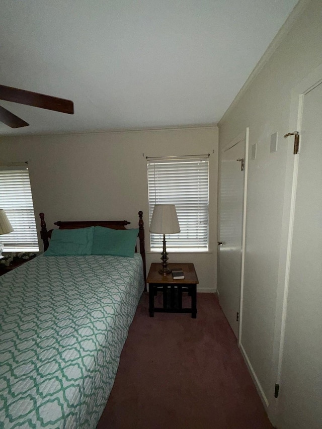 bedroom with ceiling fan and carpet floors