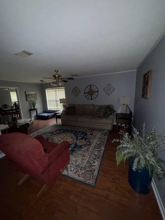 living room with dark hardwood / wood-style floors and ceiling fan