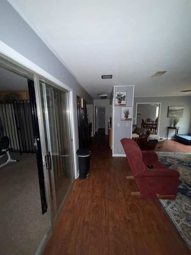 hallway featuring dark hardwood / wood-style floors