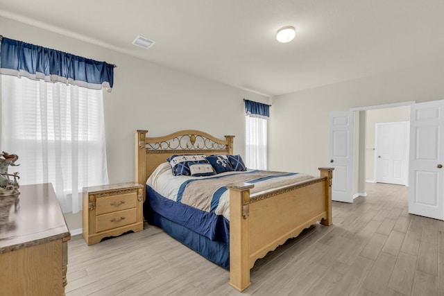 bedroom with light hardwood / wood-style floors