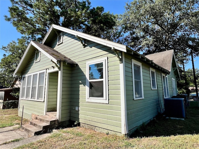 view of property exterior with central AC