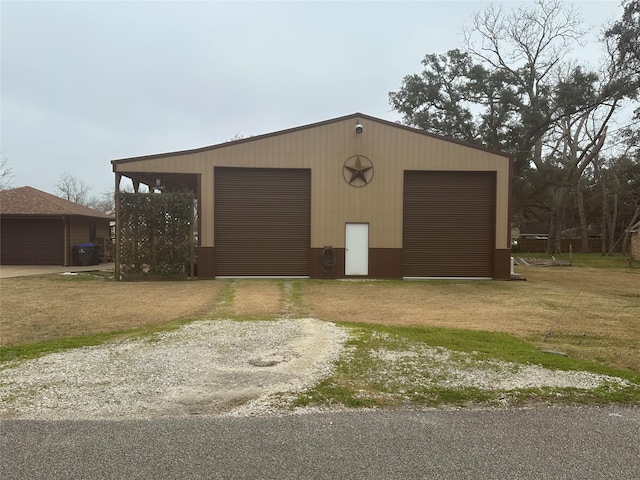 exterior space with an outbuilding and driveway