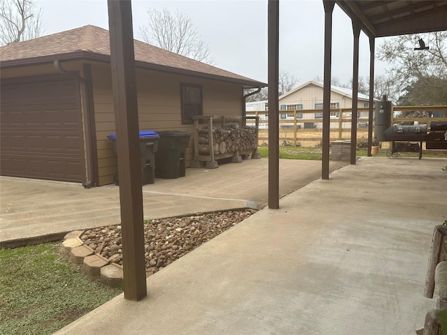 view of patio / terrace featuring a garage