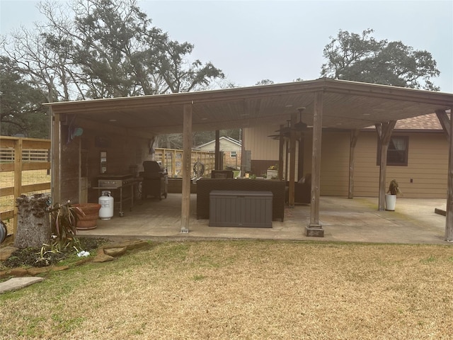 exterior space featuring fence, a lawn, and a patio