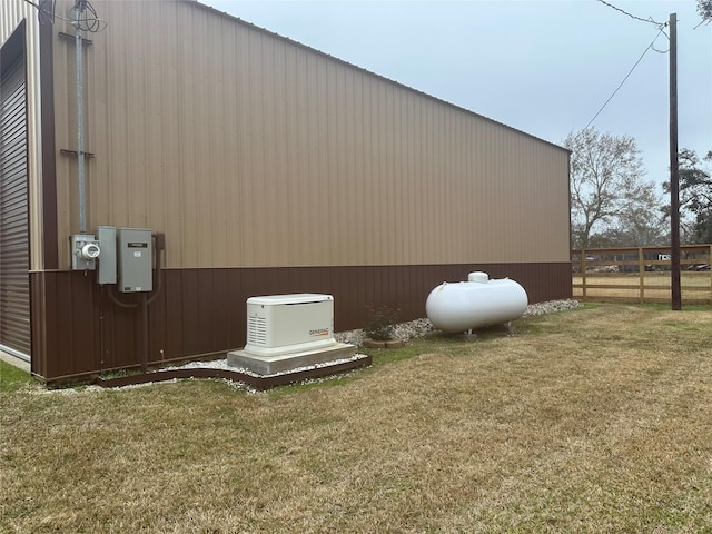 view of side of property featuring a yard