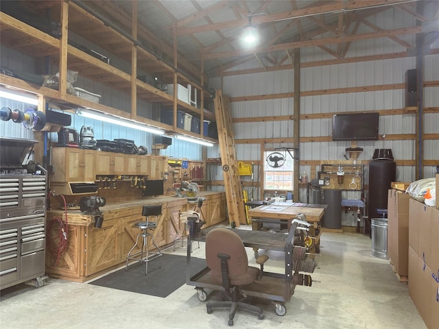 garage with a workshop area and metal wall