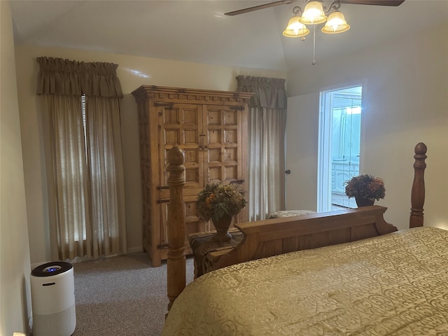 carpeted bedroom featuring lofted ceiling and ceiling fan