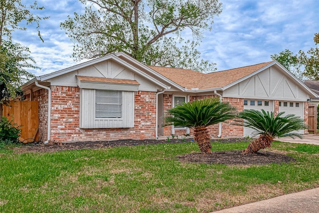 view of front facade with a garage and a front lawn