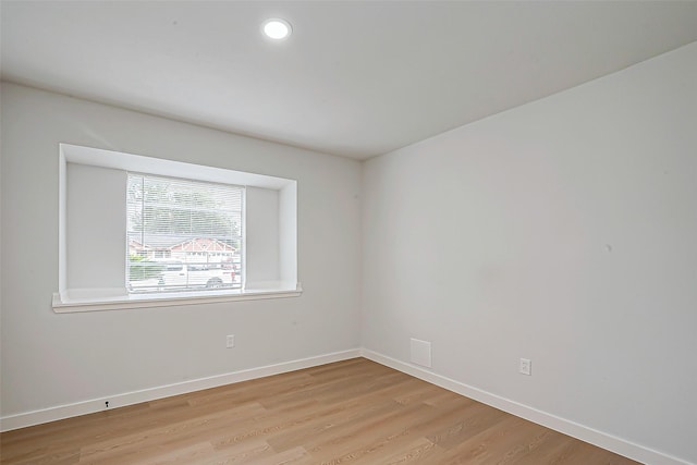 unfurnished room featuring light wood-type flooring