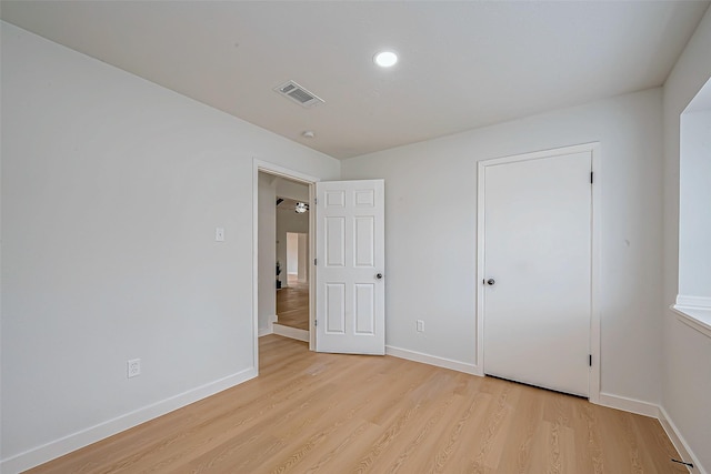 unfurnished bedroom featuring light wood-type flooring