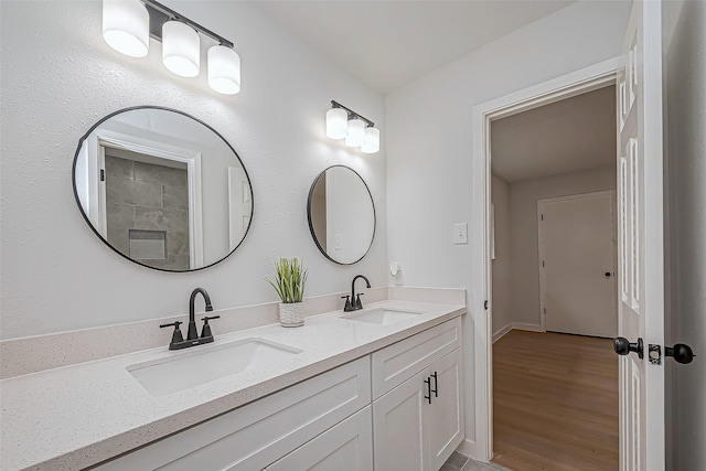 bathroom with hardwood / wood-style flooring and vanity