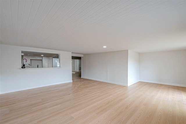 unfurnished living room with wood ceiling and light hardwood / wood-style flooring