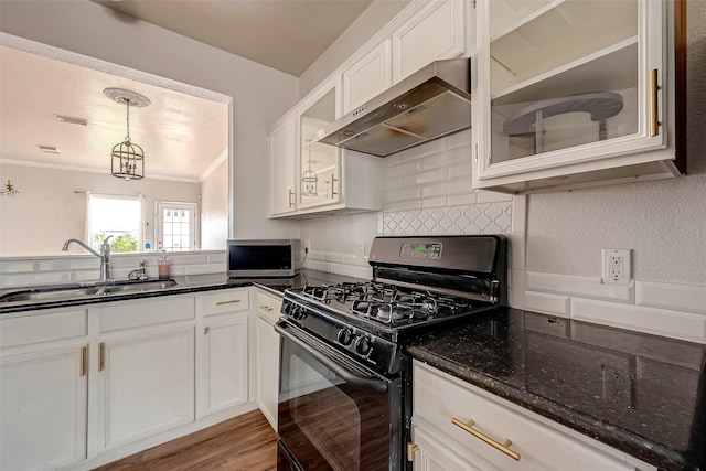 kitchen featuring white cabinets, sink, wall chimney exhaust hood, and black gas stove