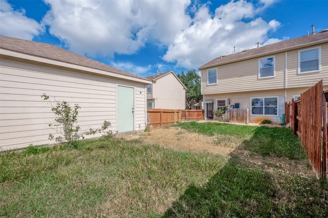 rear view of house with a lawn