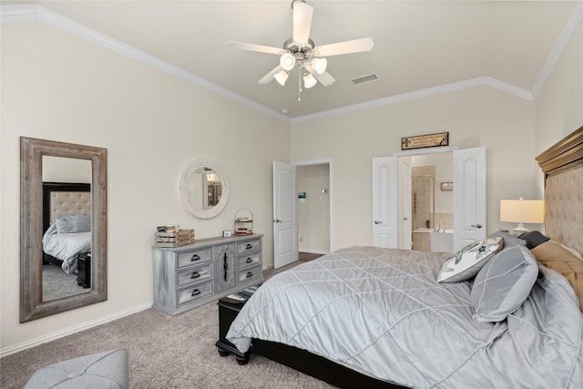 carpeted bedroom featuring ensuite bath, vaulted ceiling, ornamental molding, and ceiling fan