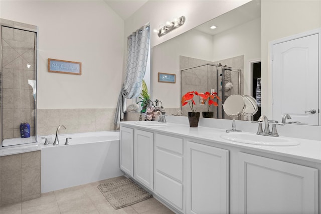 bathroom featuring tile patterned floors, vanity, and independent shower and bath