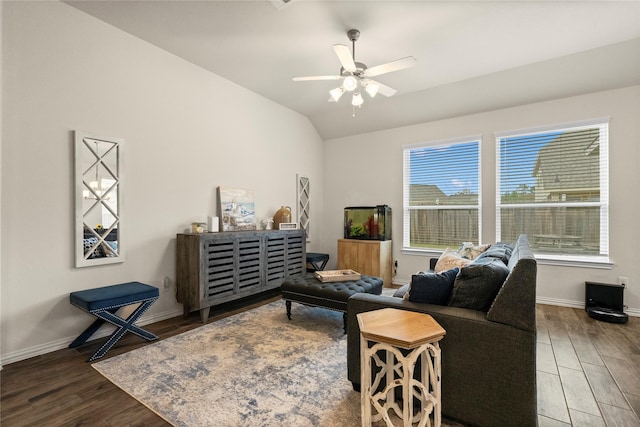 living room featuring ceiling fan, lofted ceiling, and hardwood / wood-style floors