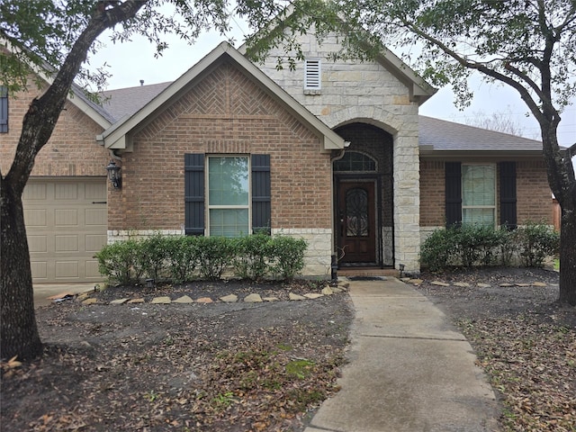 view of front of property featuring a garage