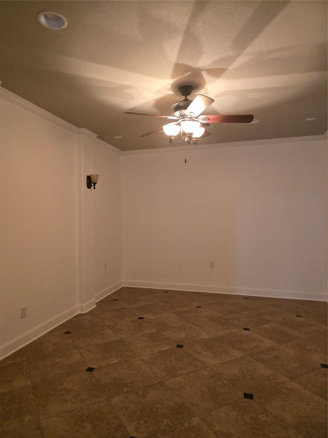 spare room with ornamental molding and ceiling fan