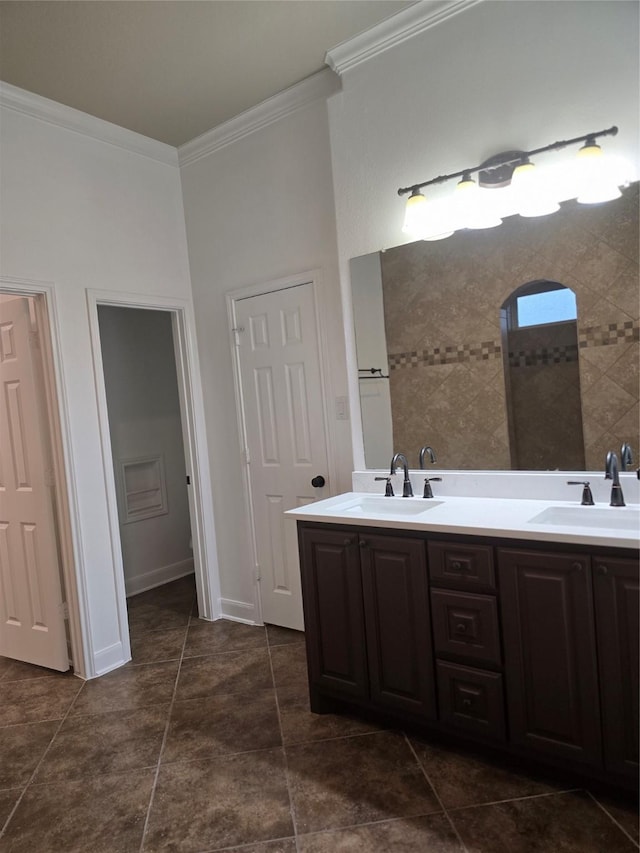 bathroom featuring crown molding and vanity