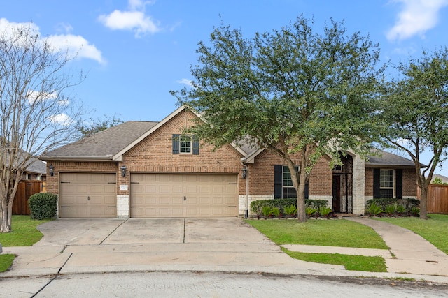 view of front facade featuring a garage and a front lawn