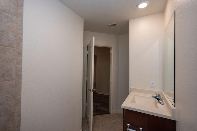 bathroom with vanity and tile patterned floors