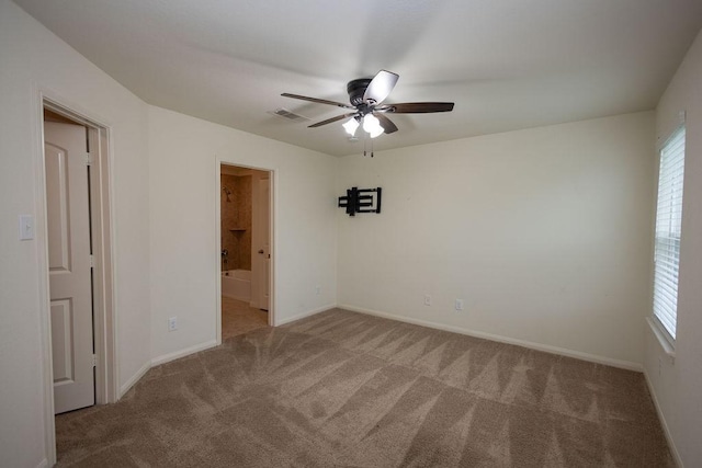 empty room with ceiling fan and carpet