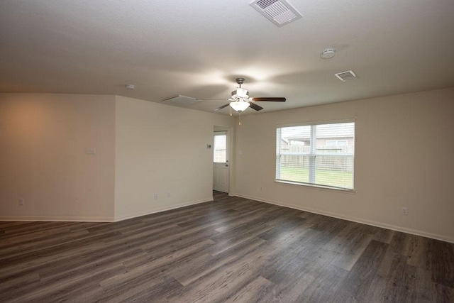 unfurnished room featuring dark wood-type flooring and ceiling fan